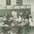 A teacher supervises a classroom with eleven children.
