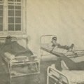 Three men restrained in beds.