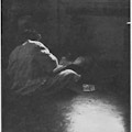 A person sitting on a floor on a ward.