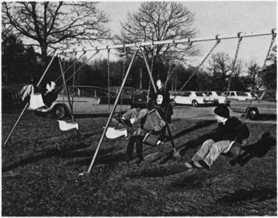 Boys on swings.