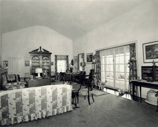 View of Top Cottage living room, including doors leading to porch.