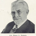 Photograph of Henry Doherty, a man with goatee and spectacles.