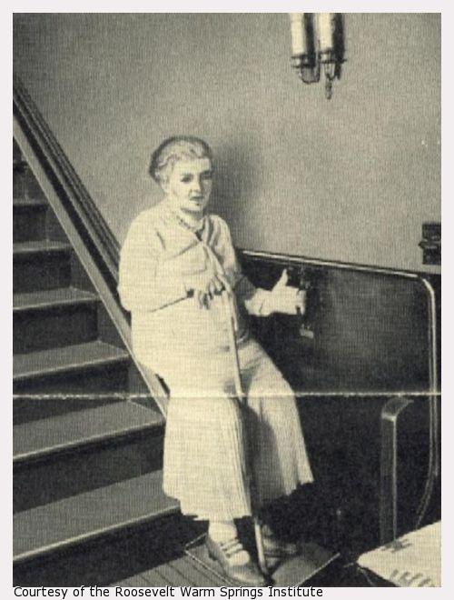 An elderly woman using an incline stair elevator.