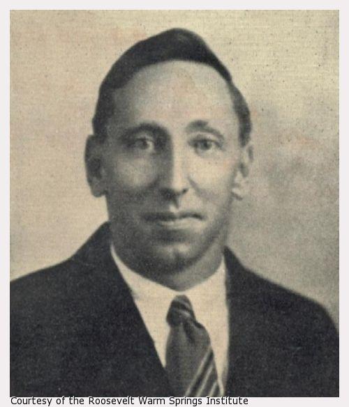 A photograph of a young man in a tie.