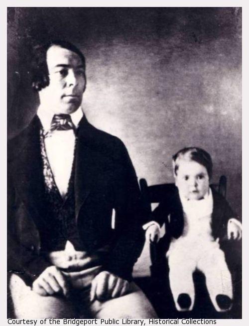 Image of young Charles Stratton sitting next to his father.