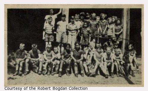Group photo of children at Camp Daddy Allen.  One child is circled in pen on the photograph and labelled "Me."