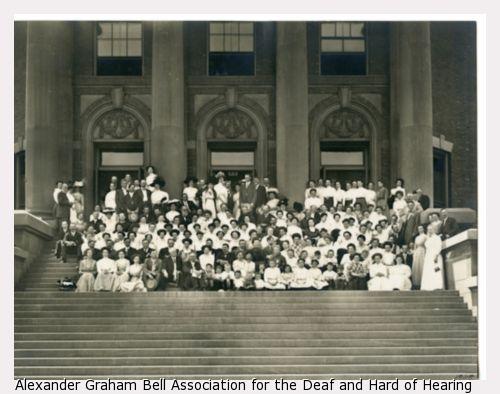 Group photograph of the American Association to Promote Teaching Speech to the Deaf Chicago School taken outdoors on the steps.