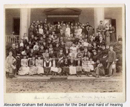 The second summer meeting for the American Association to Promote Teaching Speech to the Deaf photographed at Grosbyside Hotel Lake George.  Group of about 100 men and awomen.