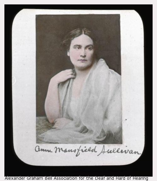 Portrait of Anne Sullivan, seated, wearing all white, head facing right with body turned left.