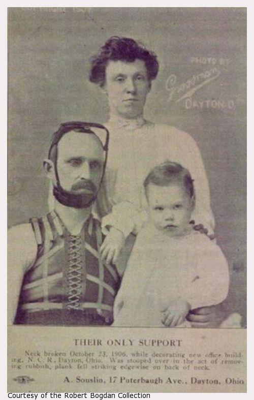 A man, woman and child pose for a family portrait; man is wearing neck/head brace.