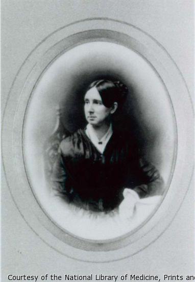 Portrait of Dorothea Dix: half-length, full face, seated, head to left, arm resting on table.
