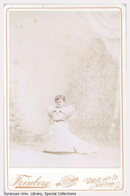 Full frontal portrait of Mrs. Tom Thumb in dress.